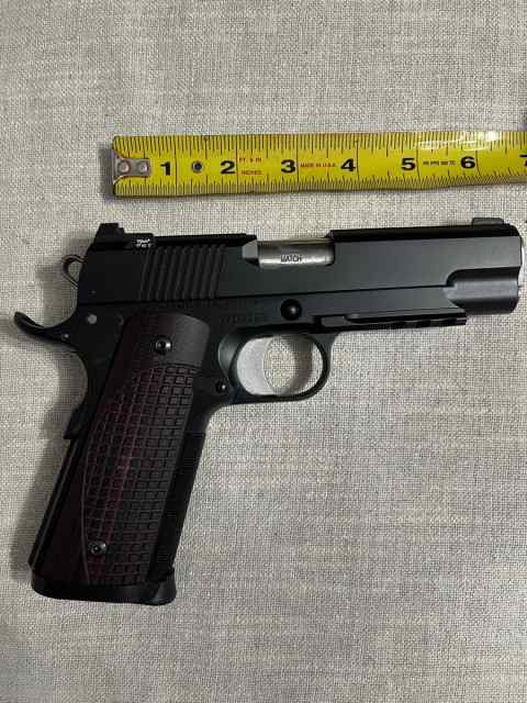 gun with tapemeasure.jpg